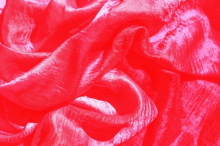 Red silk textures background. Selective focus. Valentines day Party concept. Copy space, top view, flat lay.の写真素材