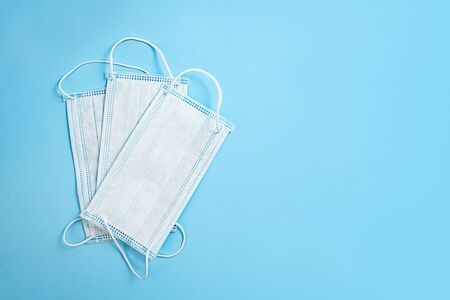 Medical masks on blue