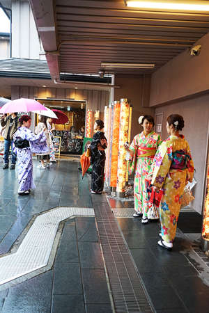 Kyoto, Japan - 03.17.20 Kyoto Japan traditional Japanese girls in kimono at Arashiyama Randen Station in Arashiyama.のeditorial素材