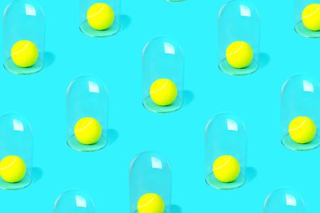 Tennis concept of isolation or quarantine. Stay at home. Pandemic idea with tennis ball and glasses on pastel blue green mint background. Outbreak of coronavirus. Virus COVID-19, 2019-nCoV.の写真素材
