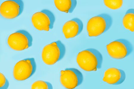 Creative layout made of lemon on green mint color background. Flat lay. Food summer concept.の写真素材
