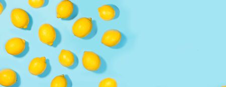 Creative layout made of lemon on green mint color background. Flat lay. Food summer concept.の写真素材