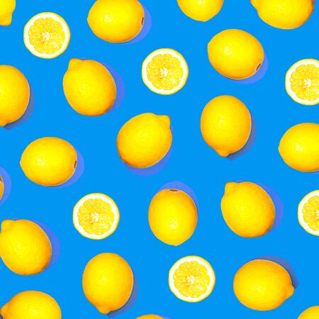 Pattern with lemon fruits. Tropical abstract geometric balance citrus on classic blue color background. Trendy summer pattern. Minimal fashion concept. Flat lay, close up.の写真素材