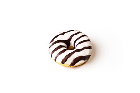 Glazed striped donut on whiteの写真素材