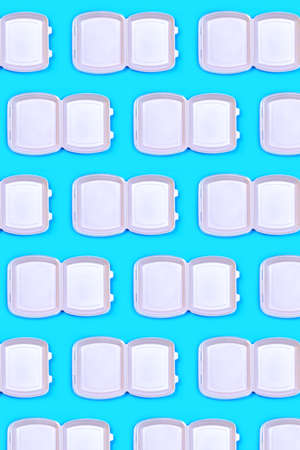 Pattern made of food delivery package or lunch box on pastel blue color background. Catering. Delivery Service in coronavirus epidemic.の写真素材
