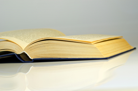 A book with open pages on white backgroundの写真素材