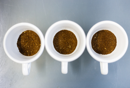 Grounded coffee in the three vwhite cupsの写真素材
