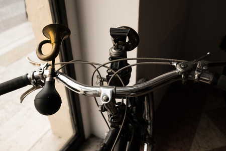 handlebar with horn like a trumpet and acetylene headlight of a vintage mopedの写真素材