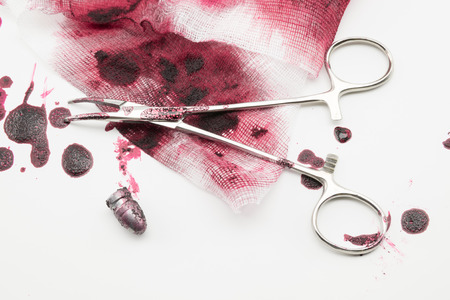 Surgical composition with bullet, blood and bandageの写真素材