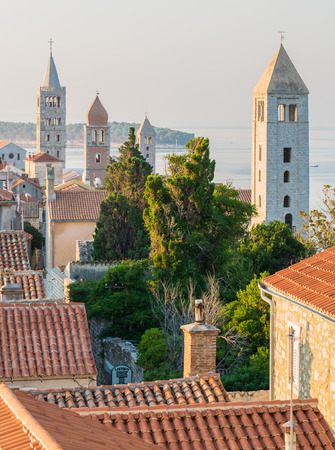 View of the town of Rab, Croatian tourist resort famous for its four bell towers.の写真素材