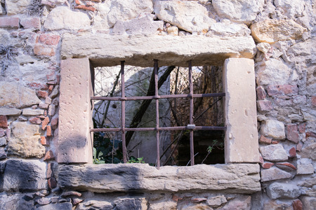 old window grille of a ruined castle in Italyのeditorial素材