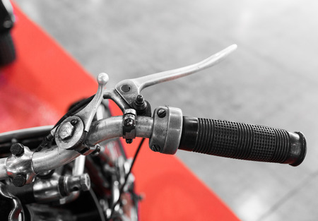 vintage motorcycle with gear lever on the handlebar to operate with thumb and forefinger of the right handの写真素材