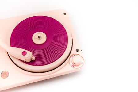 Vintage pink record player on white background with copy space on the right.の写真素材