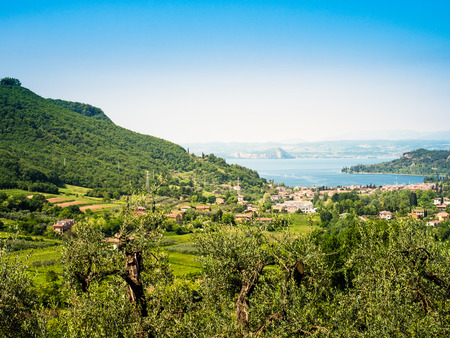 Garda lake and Garda city views from the surrounding hillsの写真素材