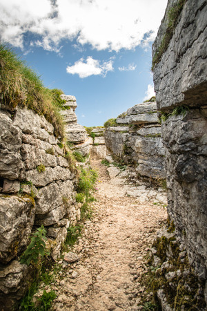 Trench dug in the rock dating back to World War I located on the Italian alps.の写真素材