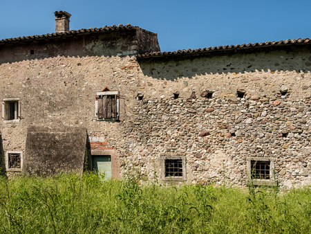 Old abandoned stone house in the Italian hills.の写真素材