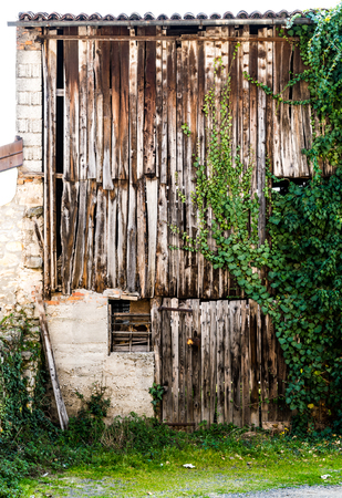 Old barn enclosed by old wooden planks.の写真素材