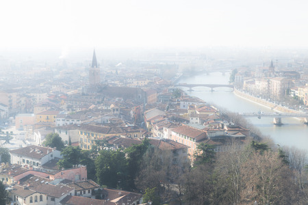 Panorama of Verona (Italy) in the fog. The city of Romeo and Juliet in a foggy winter day.の写真素材