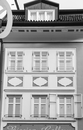Detail of the white facade of a historic residence in Bolzano, Italy.のeditorial素材