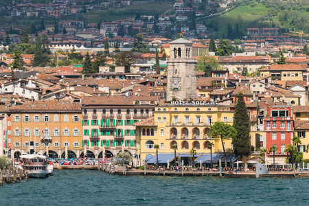 Riva del Garda, Italy - April 15, 2016: The town of Riva del Garda seen from the lake.のeditorial素材