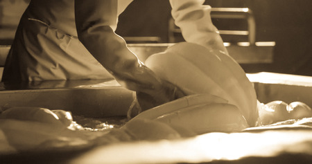 Production of provolone cheese in craft cheese factory.