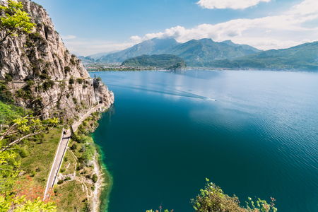 Panorama of the gorgeous Lake Garda surrounded by mountains in Riva del Garda, Italy.の写真素材