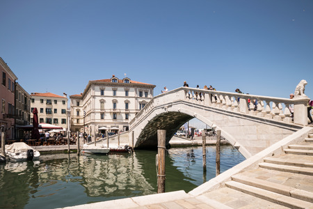 Typical bridge across a canal in Chioggia, Venetian Lagoon, Italy.のeditorial素材