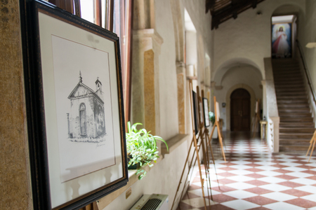 Villanova, Italy - September 7, 2014: Alessio Pegoraro, a contemporary painter from Verona, exhibits his works at the Romanesque abbey of Villanova.のeditorial素材