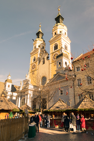 Brixen, Italy - December 26, 2016: Traditional Christmas market in Duomo Square with scenic view of the Cathedral.のeditorial素材