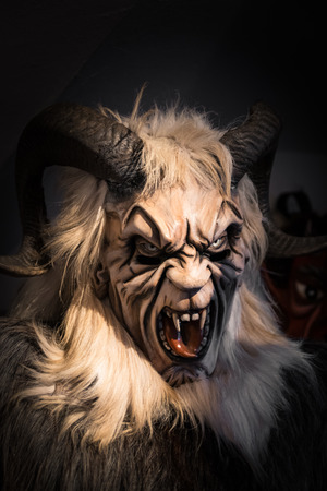 Luttago, Italy - December 23, 2016: Traditional Krampus beast-like mask from Alpine region.のeditorial素材