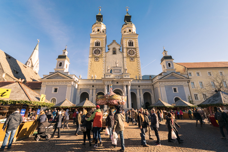 Brixen, Italy - December 26, 2016: Traditional Christmas market in Duomo Square with scenic view of the Cathedral.のeditorial素材