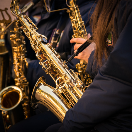 Saxophones of a town band during a performance.の写真素材
