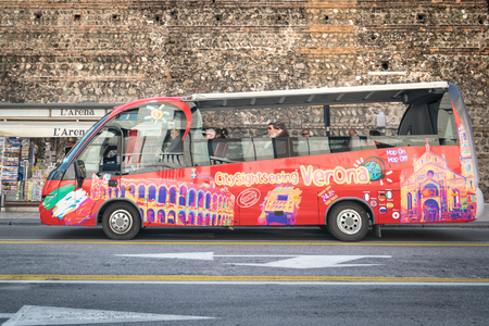 Verona, Italy - March 20, 2016: Typical open bus on the sides used to take tourists around the city.のeditorial素材