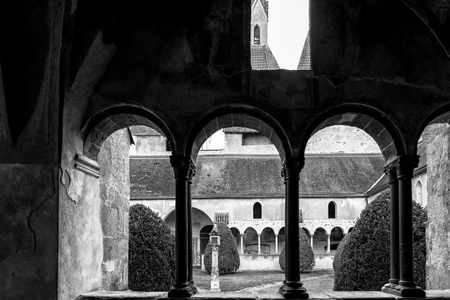 Brixen, Italy - December 26, 2016: Arched windows of cathedral cloister famous for depicting scenes of the Bible.のeditorial素材
