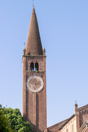 Old bell tower with ruined and broken clock.の写真素材