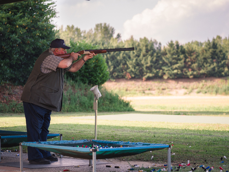 Verona, Italy - June 4, 2017: Shooter during a competition of clay pigeon shooting.のeditorial素材