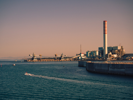 Civitavecchia, Italy - August 27, 2017: The ENEL Tower of Torrevaldaliga Nord is a coal-fired power plant with a total capacity of 1980 MW.のeditorial素材