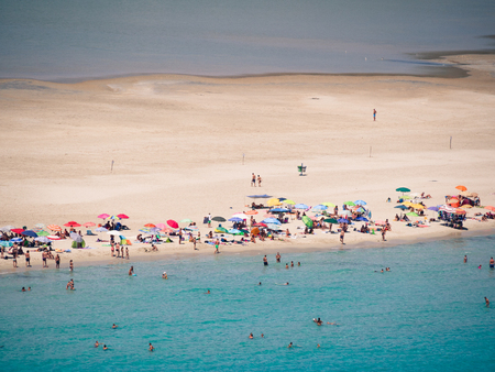 The magnificent sandy beach of Porto Giunco in Sardinia between the blue sea and the pond of Notteri famous for its pink flamingos.のeditorial素材