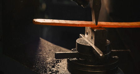 Locksmith beats the hot iron to give it the desired shape.の写真素材