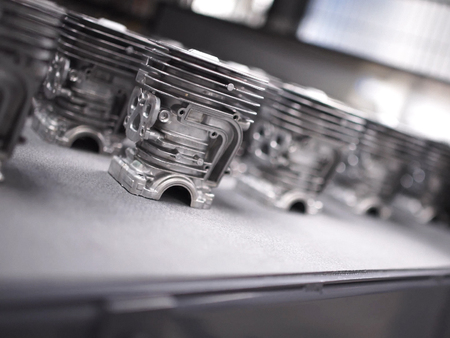 Aluminum castings in a motorcycle engine production line.の写真素材