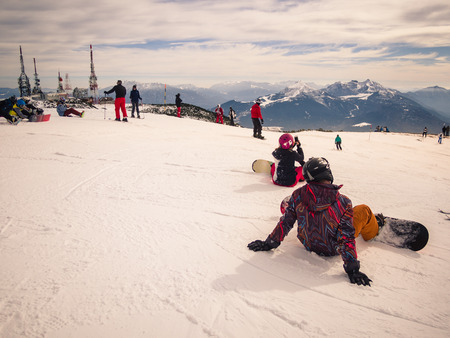 Trento, Italy - February 26, 2017: Young people on the snowboard are resting before leaving to ski.のeditorial素材