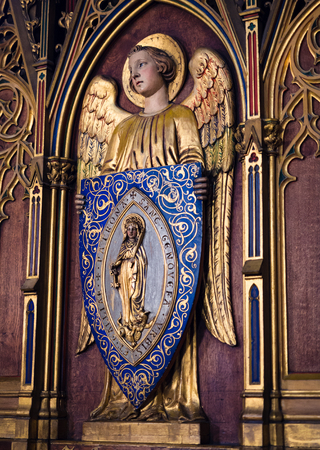 Paris, France - January 7, 2018: Golden angel supporting the effigy of Saint Genevieve inside the church of St. Stephen's of the Mount in Paris.のeditorial素材