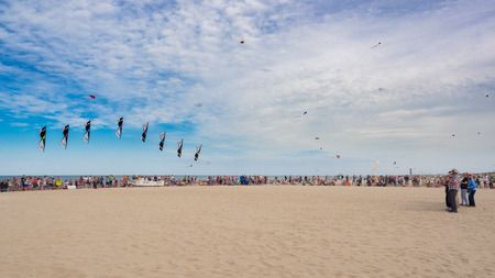 Cervia, Italy - May 1, 2018: Performance of four-wire acrobatic kites revolution by the sea on the occasion of the international kite festival.のeditorial素材