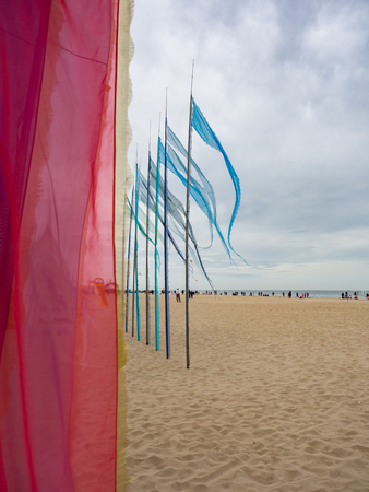 Decorations of fabrics and flags in an Italian beach.のeditorial素材