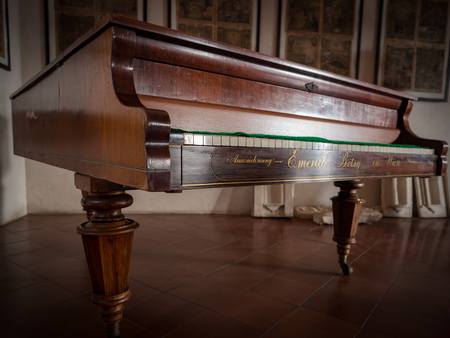 Antique Emerich Betsy piano constructed in 1854. These pianos were made with Burl Wood, each finished with hand craftsmanship inclusive of hand-carved gold and pearl inlay.のeditorial素材
