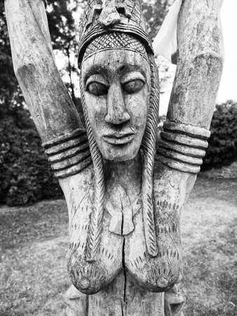 A traditional wooden African tribal statues in a public park.の写真素材