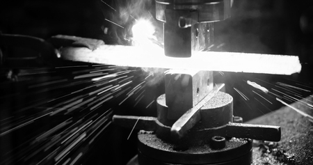 Locksmith beats the hot iron to give it the desired shape.
