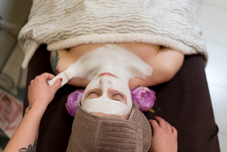 Verona, Italy - March 14, 2016: Applying beauty mask on face in a beauty salon.のeditorial素材