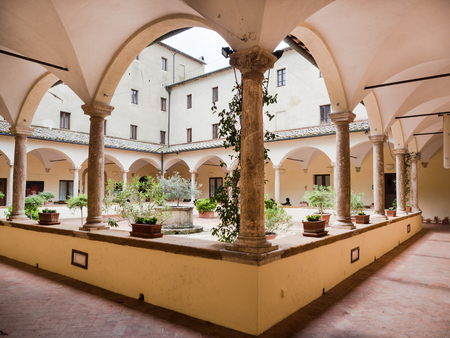 Pienza, Italy - April 23, 2019: Ancient cloister with Gothic arches and  columns.のeditorial素材