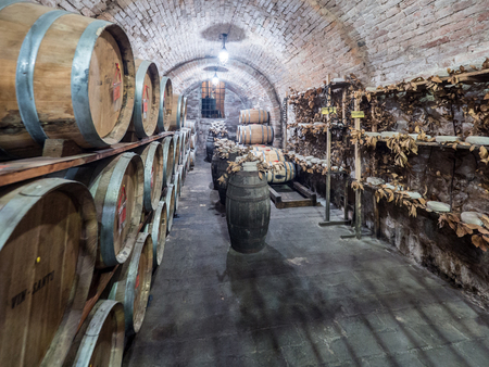 Montepulciano, Italy - April 23, 2019: Oak barrels in an old Italian underground wine cellar.のeditorial素材